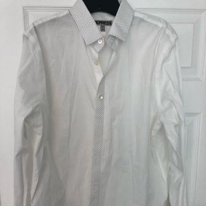 White men’s dress shirt with designer on collar.